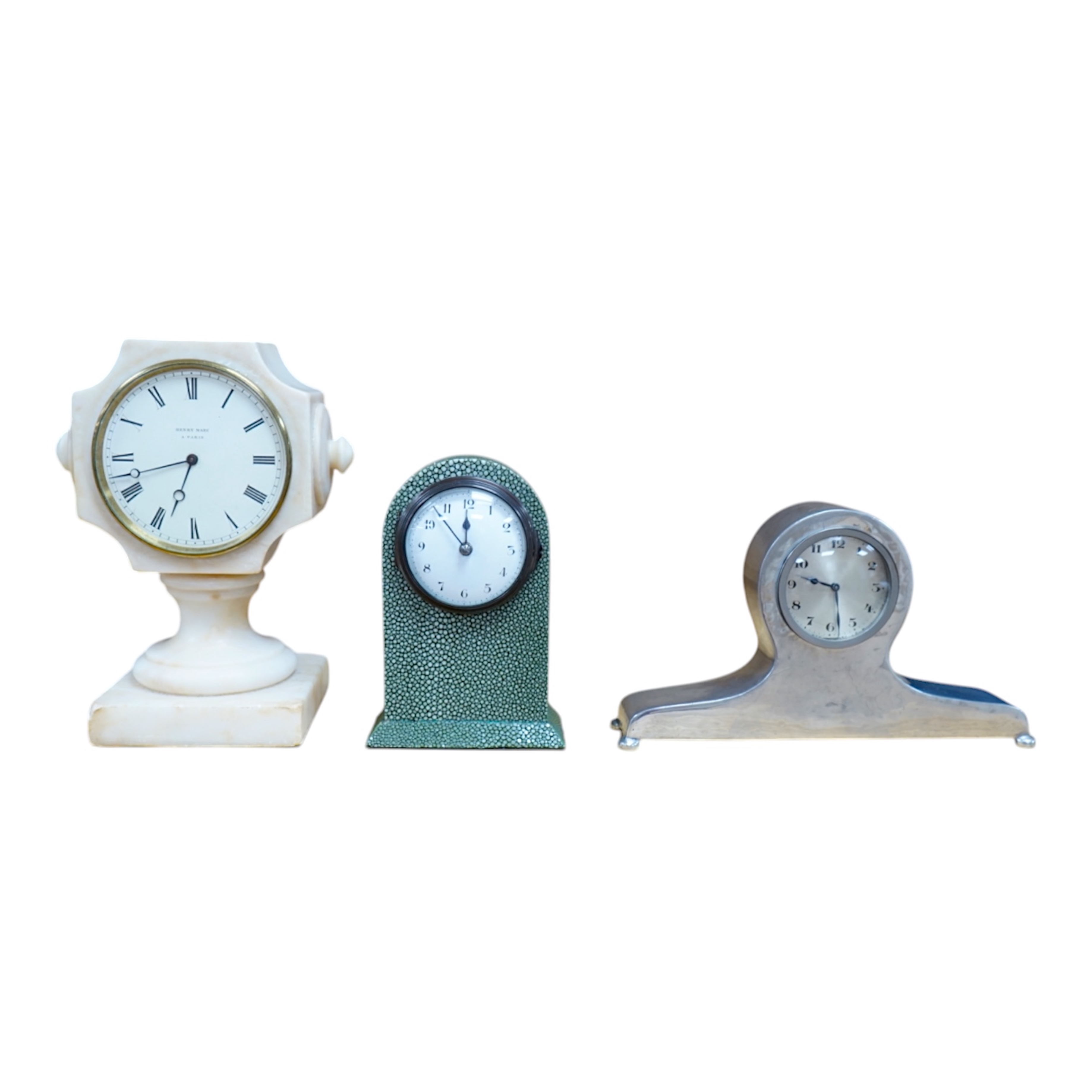 Three small mantel timepieces including a Tudric pewter timepiece, and a French timepiece in an alabaster case, signed Henry Marc, Paris. Condition - fair to good.